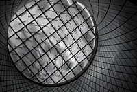 Black and white shot of glass dome with modern criss cross architecture. Original public domain image from Wikimedia Commons