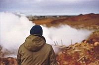 A person in a jacket faces away toward white smoke outdoors in Iceland. Original public domain image from <a href="https://commons.wikimedia.org/wiki/File:Facing_white_smoke_(Unsplash).jpg" target="_blank" rel="noopener noreferrer nofollow">Wikimedia Commons</a>