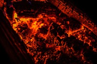 Glowing embers on hot logs in a fireplace. Original public domain image from <a href="https://commons.wikimedia.org/wiki/File:Glowing_Embers_(Unsplash).jpg" target="_blank" rel="noopener noreferrer nofollow">Wikimedia Commons</a>