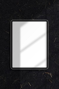 White digital tablet mockup on black marble background vector
