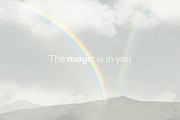 Rainbow over mountains background with text, the magic is in you