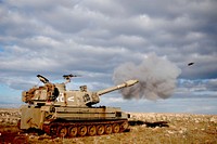 a cannon firing - M109 self-propelled howitzer. Original public domain image from <a href="https://commons.wikimedia.org/wiki/File:Cannon_fire_-_M109_self-propelled_howitzer.jpg" target="_blank" rel="noopener noreferrer nofollow">Wikimedia Commons</a>