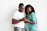 Black couple using a mobile phone together