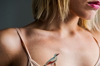 Close up of tattoo on the chest of a woman