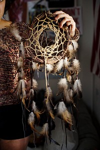 Young girl holding a DIY dreamcatcher