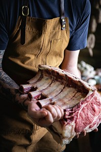 Butcher selling meat in a butcher shop food photography recipe idea