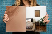 Woman showing home design magazine