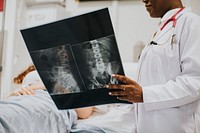 Physician showing a patient the X-ray results