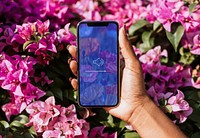 Mobile phone mockup, pink flowers wallpaper psd