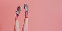 Woman legs in pink pants up in the air social banner