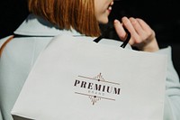 Woman with a shopping bag after a spending spree