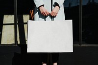 Woman with a shopping bag after a spending spree