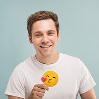 Cheerful man holding a blowing kiss icon