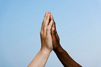 Diverse hands giving high five
