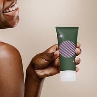 Skincare bottle mockup, smiling African woman psd