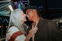 Cheerful elderly couple at Pacific Park in Santa Monica, California