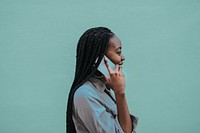 Cheerful black woman talking on the phone