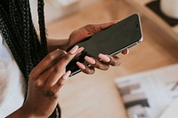 Black woman texting on her mobile phone