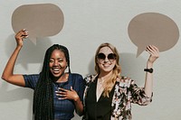 Cheerful women showing blank speech bubbles