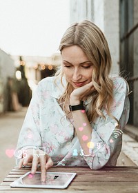 Happy woman using social media on a tablet