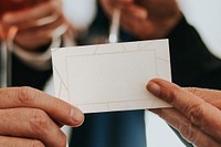 Senior businessman handing a business card