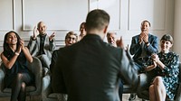Business people clapping in a seminar