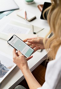 Fashion stylist using a mobile phone at work