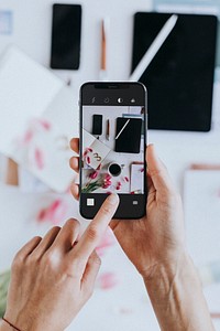 Blogger taking a photo with a mobile phone