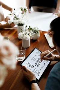 Businessman doing a creative process on digital tablet