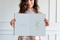 Happy woman holding a floral love text book