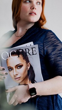 Woman holding a magazine mobile phone wallpaper