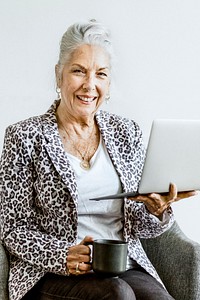 Empowering happy businesswoman holding a laptop