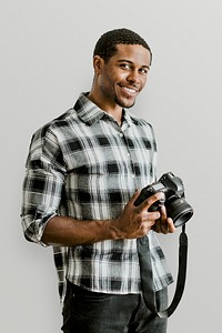 Male photographer holding a camera