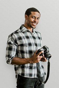 Male photographer holding a camera mockup
