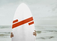 Surfer holding a surfboard