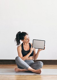 Yoga instructor showing a digital tablet mobile phone wallpaper