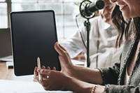 Woman pointing on a tablet screen mobile phone wallpaper