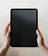 Man holding a digital tablet mobile phone wallpaper