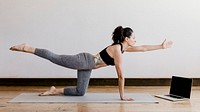 Active woman doing yoga in the room
