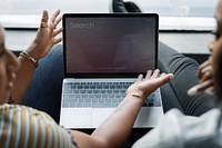 Couple discussing over a laptop screen