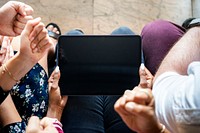 Hands holding digital tablet