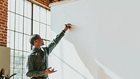 Businessman standing by a presentation board