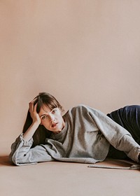 Brown hair model posing in a studio