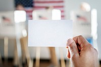 Man showing ballot up in the air