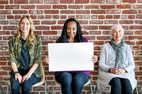 Diverse women showing blank posters template