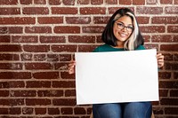 Hispanic girl showing an empty paper