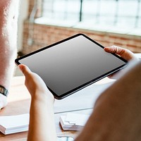 Woman holding a digital tablet