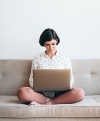 Woman using a laptop at work