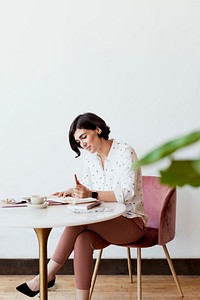 Young woman writing a journal