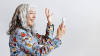 Happy woman waving hello to a smartphone social template